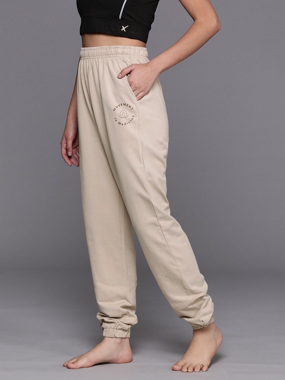 Women Solid Beige Track Pants